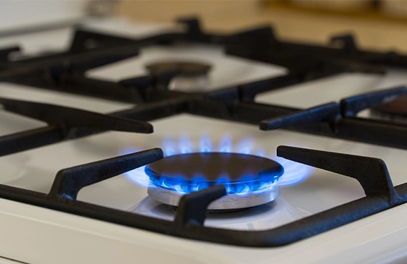 Gas stove appliance installed in a wooden home kitchen in Cape Town, South Africa